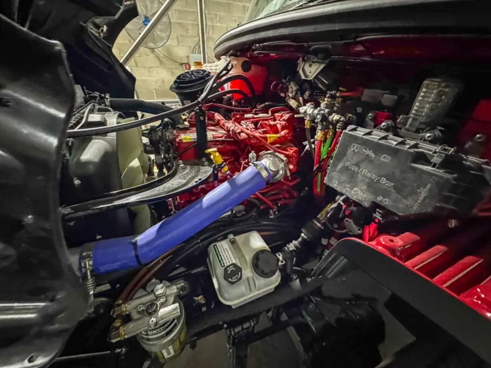 Engine and hose connection hardware detail, photo 39 of 303.